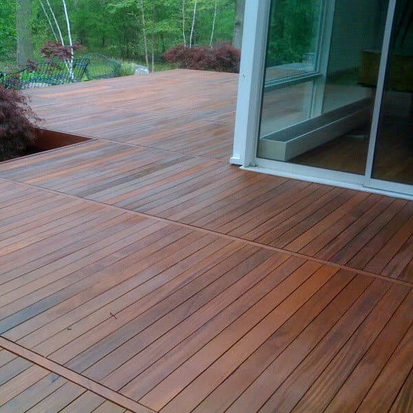 A close view of freshly stained deck boards with the grain showing through